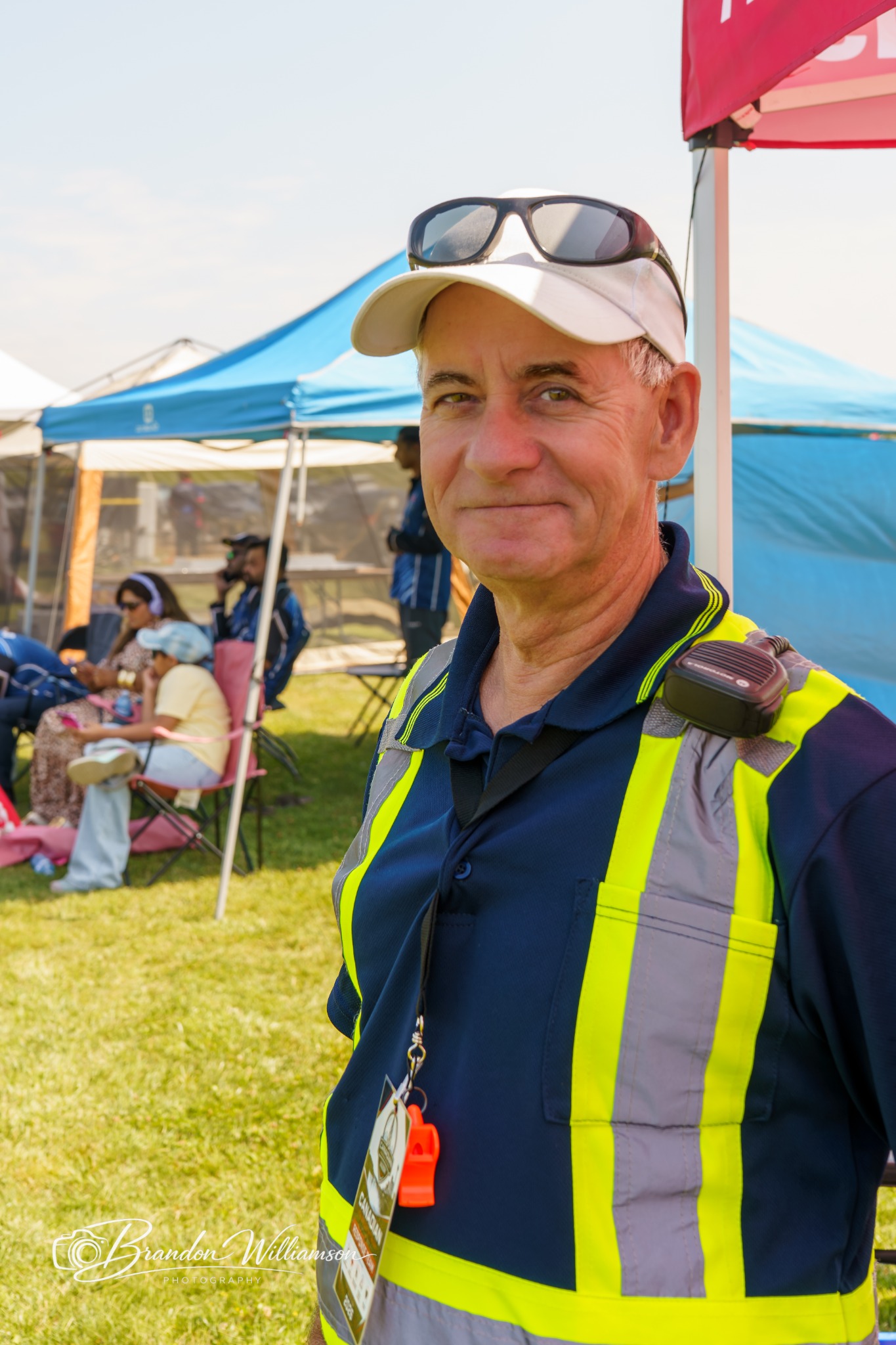 A Canadian Response Network staff member equipped with a two-way radio at a community event